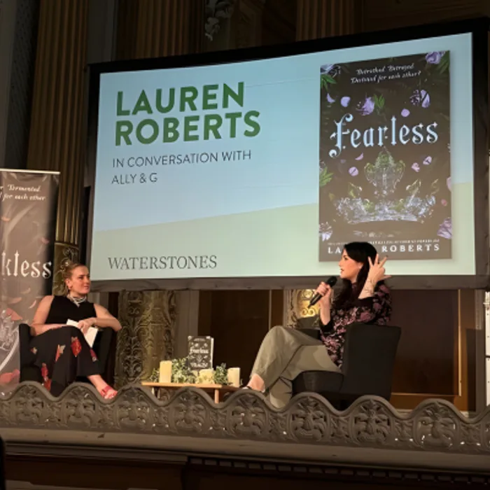 An author speaking at a bookshop launch event