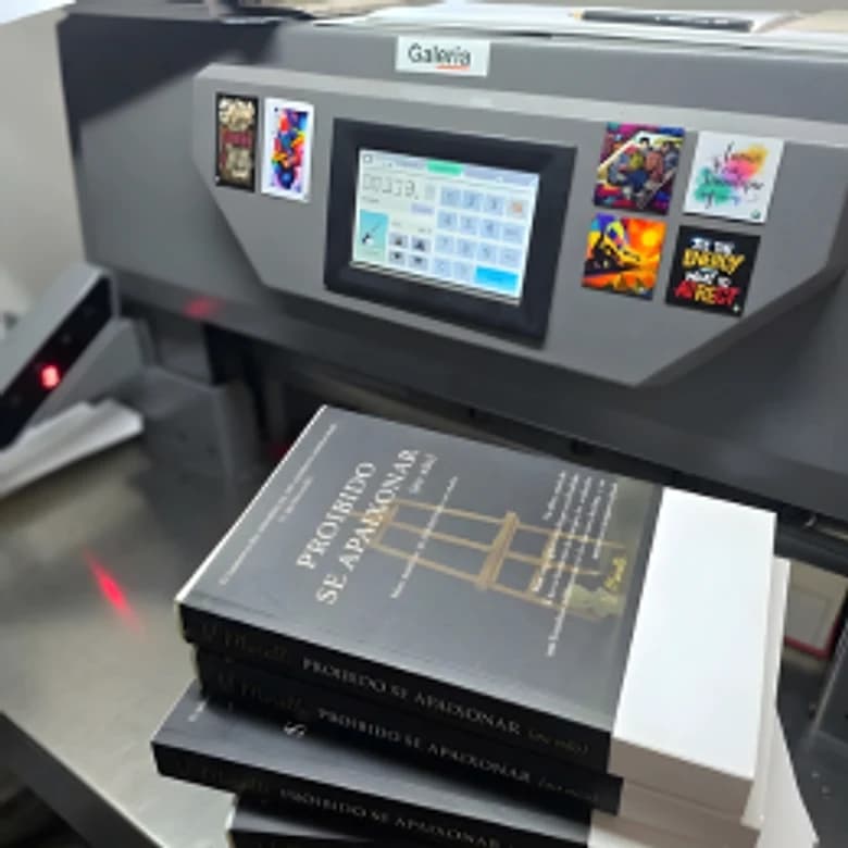 Finished hardback copies coming off the printing machine